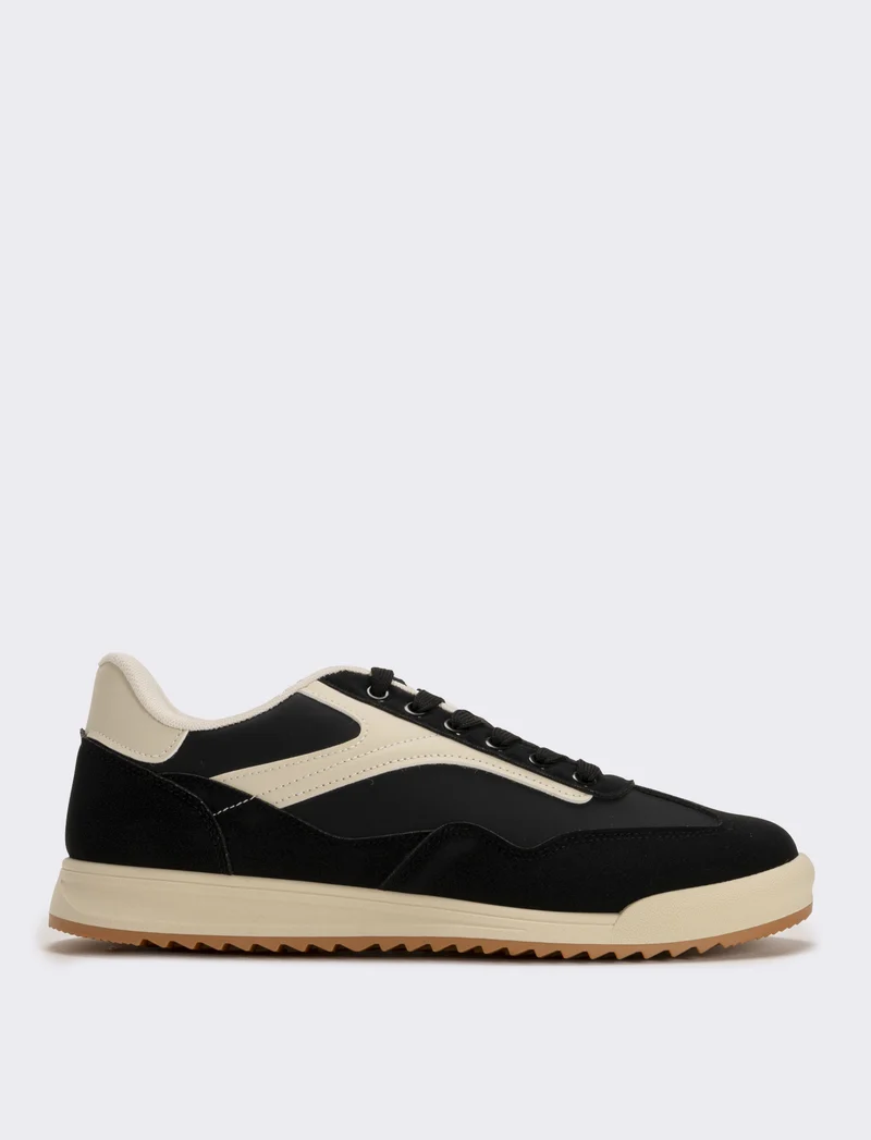 Sneakers nere in poliuretano con dettagli bianchi - Nero
